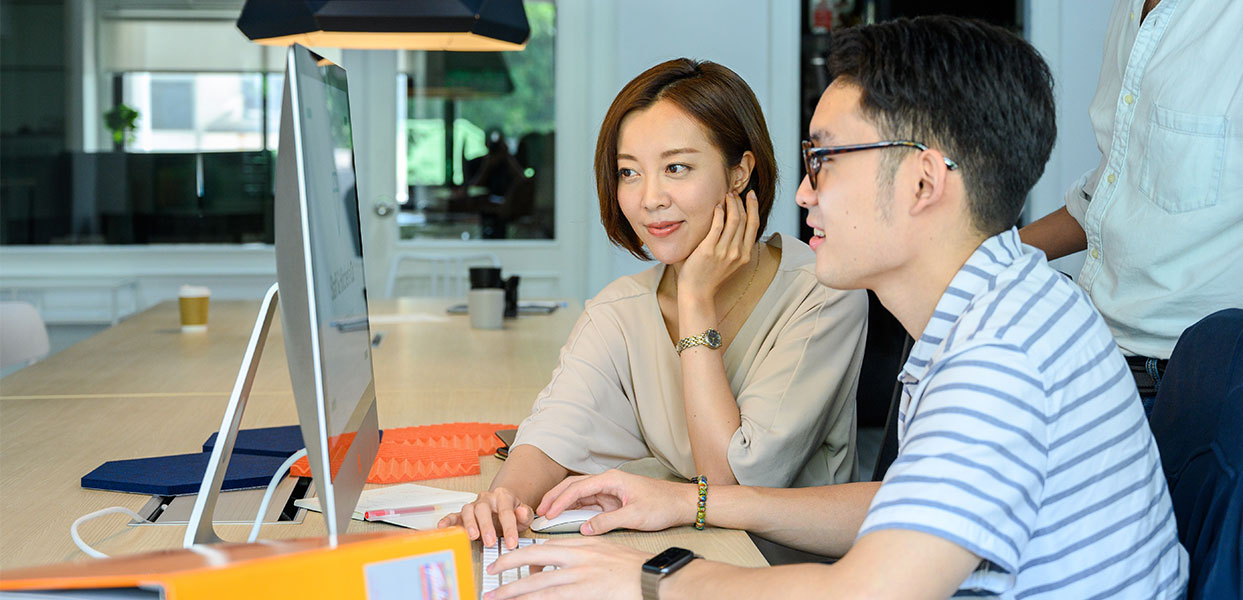 Man and Woman Looking at Computer Man and Woman Looking at Computer
